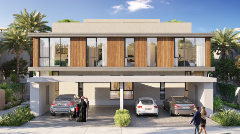 Une maison moderne située dans les collines de Dubaï avec un toit plat et de grandes fenêtres vitrées, comprenant un garage ouvert avec quatre voitures garées, entouré de palmiers et de passants.