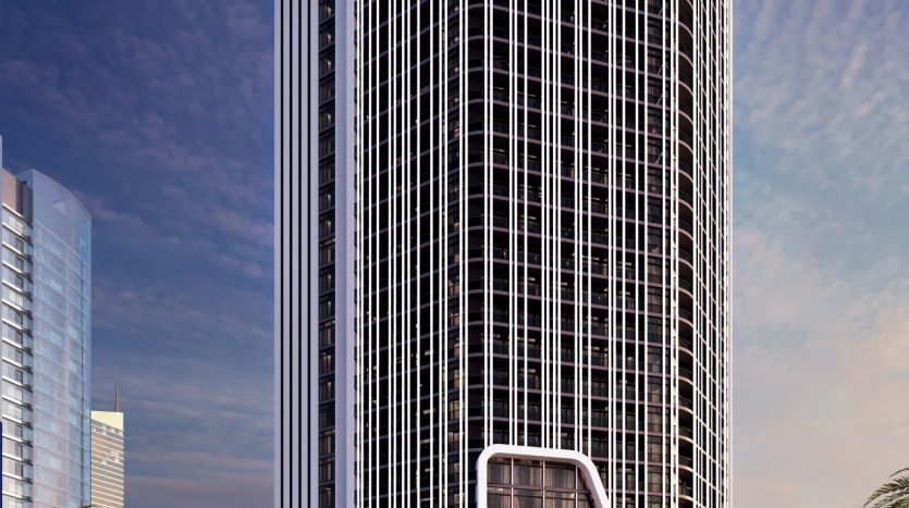 Un rendu architectural d&#039;un immeuble futuriste de grande hauteur aux bords incurvés, avec une signalisation &quot;Bayz&quot; proéminente en haut et à la base, des piétons qui passent et un ciel bleu clair en arrière-plan.
