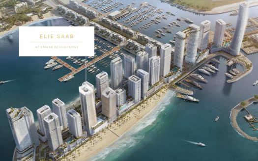 Vue aérienne d&#039;un complexe immobilier de luxe côtier avec des immeubles de grande hauteur le long d&#039;une plage, avec la mention « front de mer elie saab emaar », entouré de marinas avec de nombreux bateaux.