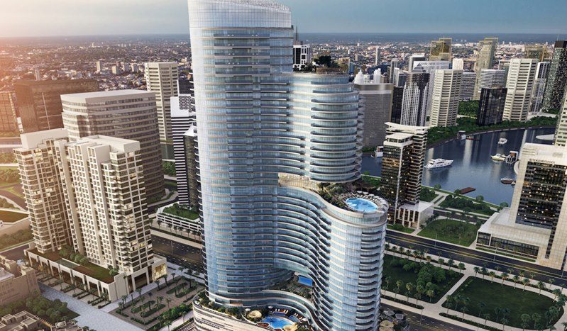 Le rendu artistique du complexe de gratte-ciel « Imperial Avenue » présente une conception moderne et curviligne avec plusieurs tours surplombant une rivière dans une zone urbaine densément peuplée. Le design présente des vagues