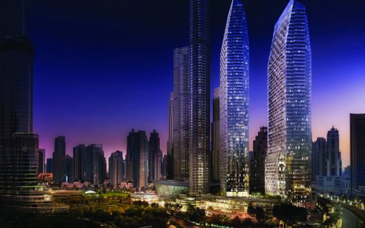 Paysage urbain nocturne avec des gratte-ciel illuminés aux designs modernes et élégants sur un ciel sombre dans un cadre urbain près de l'Address Residences Dubai Opera.