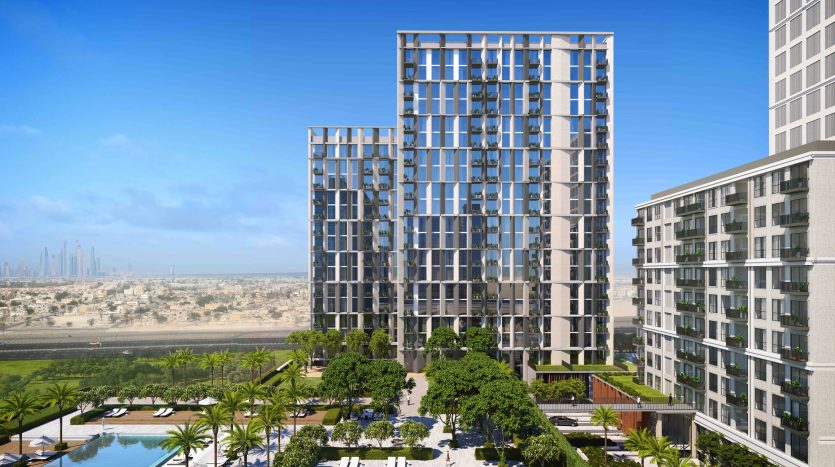 Un rendu vibrant du complexe Collective 2.0 de Dubai Hills, comprenant plusieurs immeubles de grande hauteur dotés de vastes façades en verre, entourés d&#039;un aménagement paysager verdoyant, de palmiers et d&#039;une piscine, sous