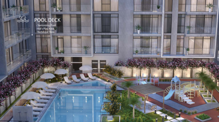 Une luxueuse terrasse de piscine d&#039;hôtel au crépuscule comprenant une grande piscine, une aire de jeux pour enfants et un espace barbecue à l&#039;Aria Résidence Dubai, entourée de façades de bâtiments modernes et décorée de plantes luxuriantes,