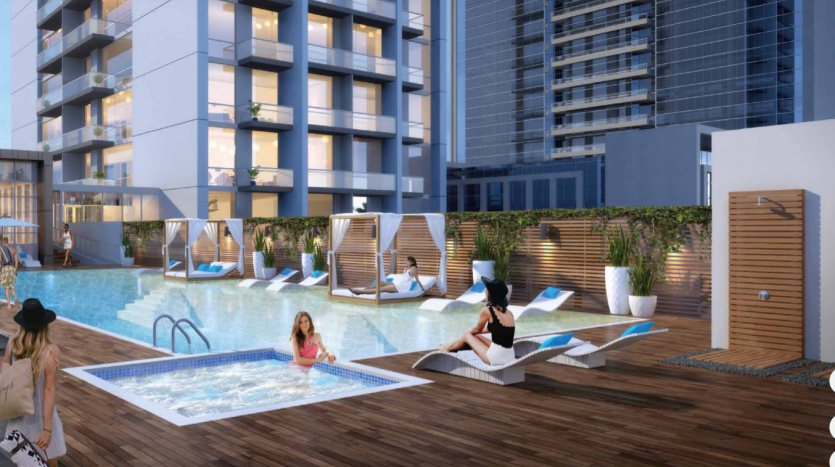 Espace piscine luxueux sur le toit d&#039;un immeuble d&#039;appartements moderne à Dubaï, où les résidents se détendent sur des chaises longues et des cabanes élégantes, entourés d&#039;une architecture contemporaine.