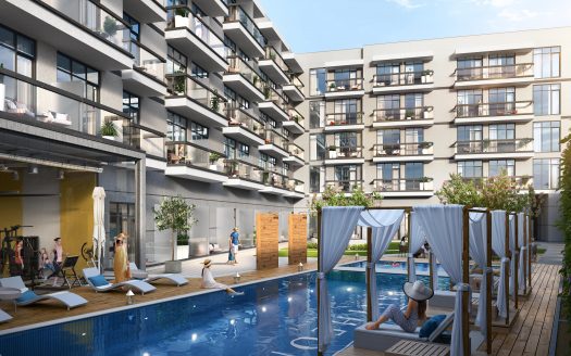 Immeubles d&#039;appartements modernes du Panthéon Elysée 2 avec balcons donnant sur une piscine commune dotée de chaises longues, de cabanes et de résidents profitant de la journée ensoleillée.