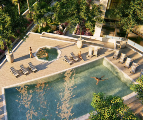 Vue aérienne d&#039;une luxueuse piscine extérieure de la Nobles Tower avec des chaises longues, des jardins paysagers et des personnes bénéficiant des commodités.