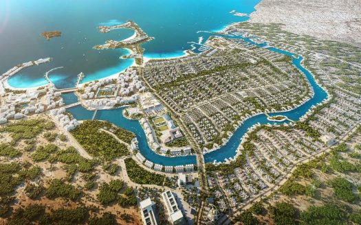 Vue aérienne d'une ville balnéaire côtière avec une île distinctive en forme de dauphin au centre, entourée de marinas, de verdure luxuriante et de zones résidentielles selon les distinctions al jure.
