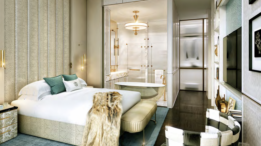 Chambre luxueuse dans une villa à Dubaï comprenant un grand lit avec une literie pastel, des panneaux muraux élégants et un jeté en fourrure moelleux. La pièce comprend un mobilier moderne, une table ronde et un élégant
