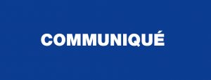 На изображении белыми заглавными буквами написано слово "communiqué" на сплошном синем фоне, а также логотип Dubai Immo guest and co.