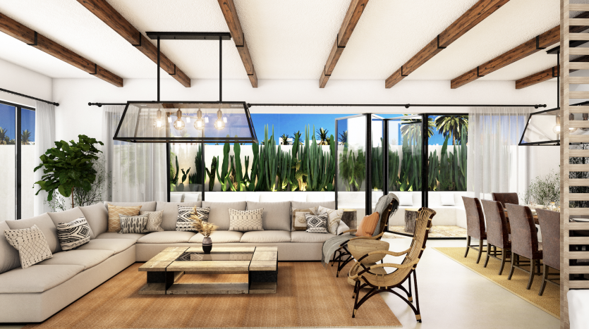 Salon moderne et spacieux à Damas Hills 3 avec de grandes fenêtres donnant sur des plantes tropicales, comprenant un canapé sectionnel beige, une table basse en bois, des poutres apparentes et un lustre chic.