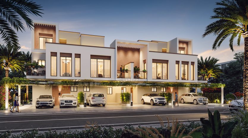Maisons de ville modernes à Damas Hills 3 présentant un mélange d&#039;architecture traditionnelle et contemporaine, des murs blancs avec de grandes fenêtres en verre et des balcons ornés de plantes. Aire de stationnement devant avec voitures de luxe.
