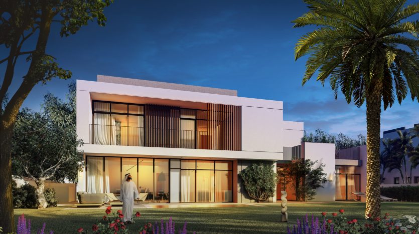Maison moderne de deux étages à Al Furjan éclairée au crépuscule, dotée de grandes fenêtres en verre et de lattes de bois, entourée de jardins bien entretenus et de palmiers.