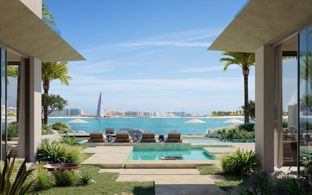 Luxueuse terrasse de villa en bord de mer avec piscine à débordement surplombant un océan bleu serein, flanquée de palmiers et d'une architecture moderne Six Senses, avec un horizon de ville lointain.