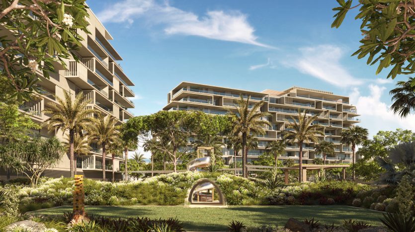 Une image rendue numériquement présentant un complexe d&#039;appartements moderne et luxueux à six sens entouré d&#039;une verdure luxuriante et de grands palmiers, sous un ciel bleu clair.