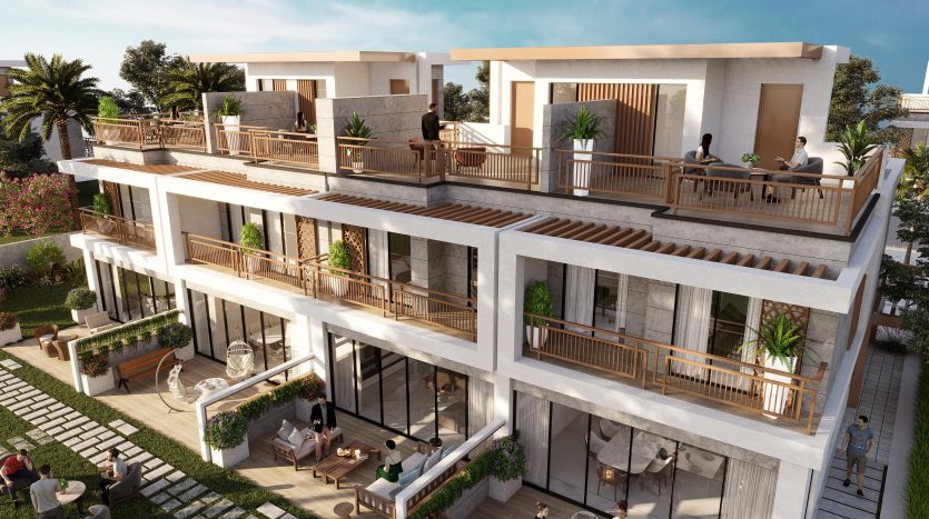 Immeuble d'appartements de luxe moderne à plusieurs niveaux à Dubaï avec des balcons spacieux, du mobilier d'extérieur et une verdure luxuriante. Les gens socialisent et profitent du temps ensoleillé.