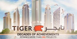 Рекламный баннер для Tiger Properties с изображением горизонта современных высотных зданий и логотипа тигра, а также текстом "десятилетия достижений - реализовано более 200 проектов".