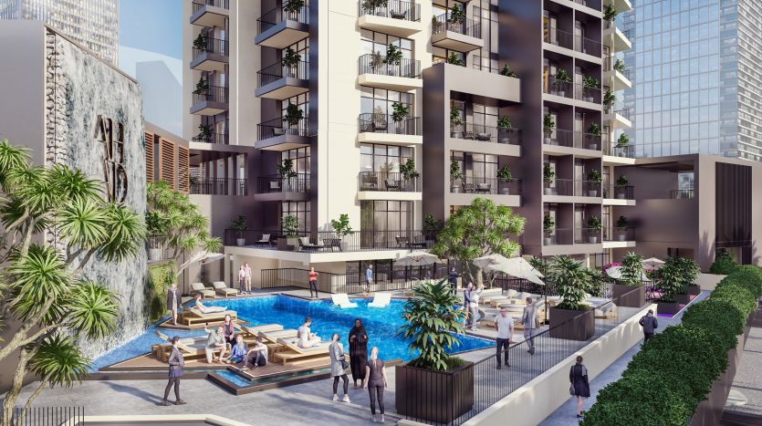 Immeuble d&#039;appartements moderne à Dubaï avec une piscine luxueuse entourée d&#039;une verdure luxuriante et des résidents se prélassant, situé dans un cadre urbain.