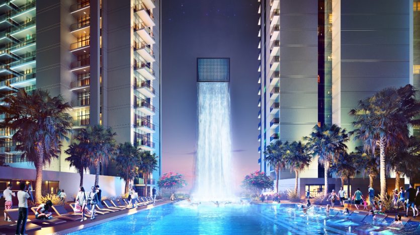 Une soirée animée au bord de la piscine d&#039;un hôtel de luxe flanquée d&#039;immeubles de grande hauteur, avec une grande fontaine d&#039;eau, avec des gens socialisant et se prélassant sous des palmiers illuminés à Dubaï.