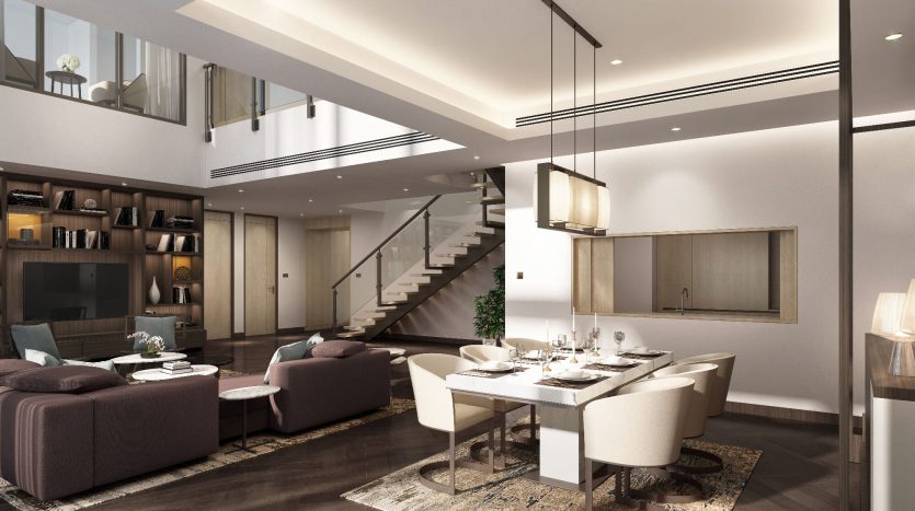 Une villa moderne à Dubaï avec un salon et une salle à manger comprenant un canapé, des fauteuils, un escalier, une table à manger et des étagères intégrées, éclairées par la lumière naturelle et des suspensions élégantes.
