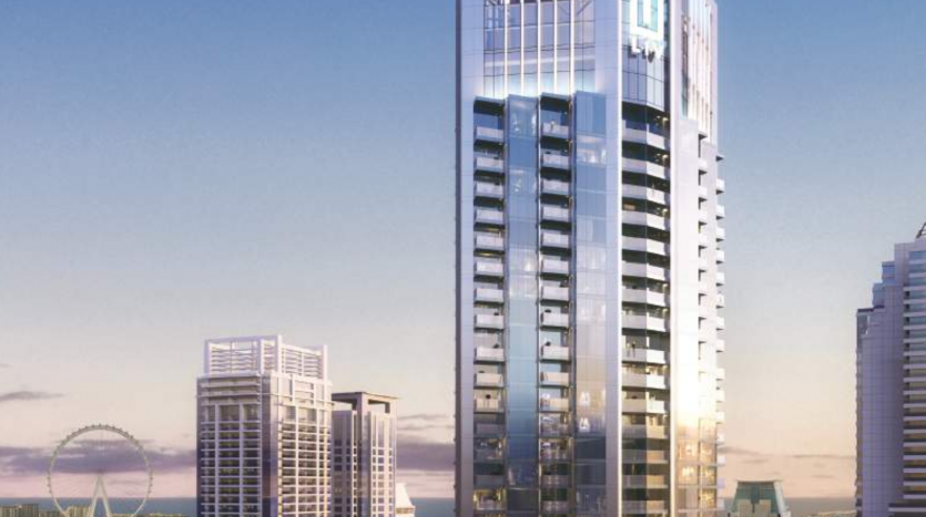 Un gratte-ciel moderne se dresse bien en évidence sur un ciel de coucher de soleil à Dubaï, entouré d&#039;autres immeubles de grande hauteur avec un aperçu d&#039;une grande roue en arrière-plan.