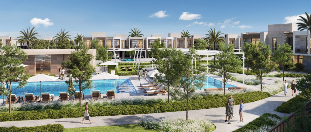 Vue aérienne d'un complexe luxueux à Dubaï avec des villas modernes entourant plusieurs piscines et une verdure luxuriante, avec des gens se promenant tranquillement le long des sentiers.