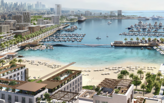 Vue aérienne d'une ville côtière moderne de Dubaï avec des gratte-ciel et une marina remplie de yachts, entourée d'une verdure luxuriante et d'une plage de sable menant à la mer bleu clair.