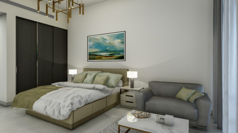 Une chambre moderne dans une villa de Dubaï comprenant un lit king-size beige avec une literie verte, deux lampes de chevet, un canapé gris, une petite table basse et un grand paysage marin au mur.
