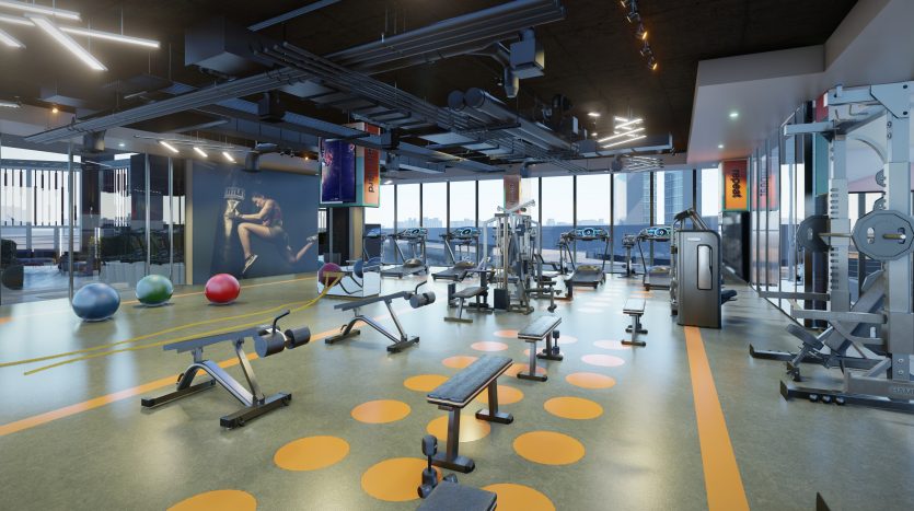 Une salle de sport moderne dans une villa de Dubaï avec divers équipements, notamment des tapis roulants, des vélos d&#039;exercice, des appareils de musculation et des poids libres. Le sol présente des motifs circulaires colorés et de grandes fenêtres offrent une vue sur la ville.
