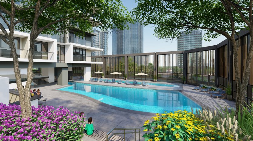Complexe résidentiel moderne à Dubaï avec une piscine extérieure entourée de verdure luxuriante et de fleurs. Les gens se détendent au bord des chaises longues et des cabanes au bord de la piscine, avec de grands immeubles de la ville en arrière-plan.