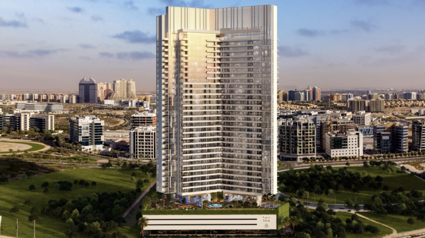 Un appartement résidentiel moderne de grande hauteur à Dubaï au design élégant, entouré de parcs verdoyants et d&#039;autres développements urbains sous un ciel dégagé.