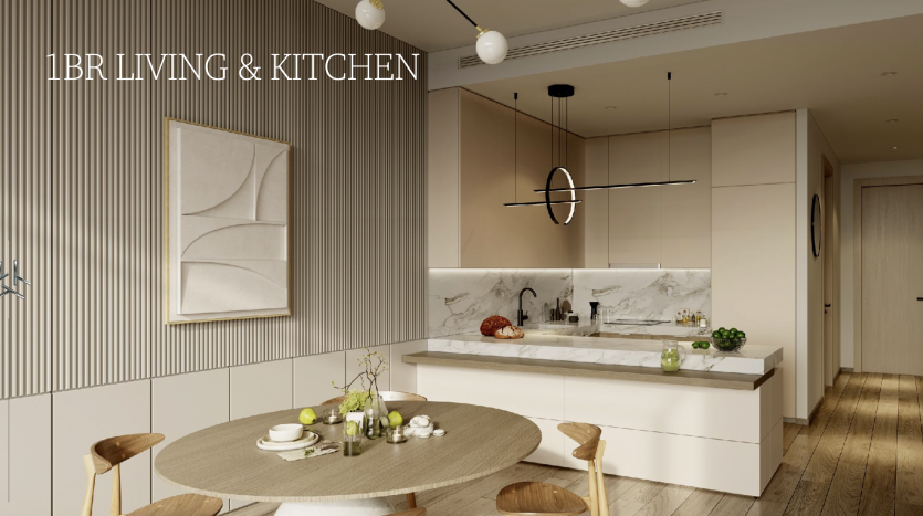 Appartement moderne d&#039;une chambre à Dubaï avec une table à manger ronde élégante, des chaises beiges, des comptoirs de cuisine blancs et une décoration minimaliste. Superposition de texte : « 1br salon et cuisine ».