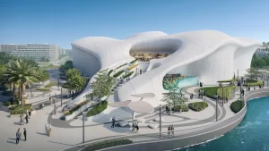 Villa futuristica a Dubai con una facciata liscia, bianca e ondulata, circondata dal verde e da uno specchio d'acqua, con persone che camminano e interagiscono in un soleggiato parco urbano.