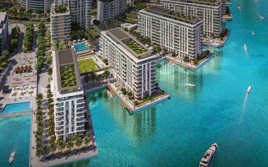 Vue aérienne d'un luxueux développement immobilier de Dubaï en bord de mer avec des immeubles modernes de grande hauteur entourés d'eau turquoise vibrante, avec une verdure luxuriante, des piscines et des bateaux naviguant à proximité.