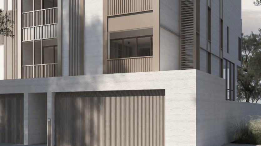 Une villa architecturale moderne à Dubaï présentant une structure à plusieurs étages au design minimaliste, de grandes fenêtres et des balcons extérieurs, complétés par des murs en béton texturé.