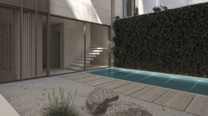Conception architecturale moderne comprenant une piscine rectangulaire bordée de carreaux turquoise, entourée d&#039;un jardin minimaliste avec des rochers et des buissons, sur fond de grands immeubles d&#039;appartements élégants à Dubaï.