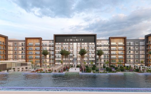 Un rendu numérique d'un complexe résidentiel moderne nommé "The Community", composé de bâtiments à plusieurs étages avec balcons, entourés de palmiers et bordés d'un plan d'eau pittoresque, idéal pour ceux qui recherchent