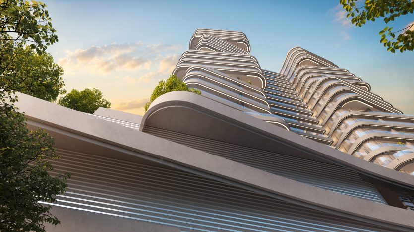 Une villa moderne et architecturalement dynamique à Dubaï avec des façades ondulées et superposées, sur un ciel clair au lever du soleil, entourée d&#039;arbres verts luxuriants.