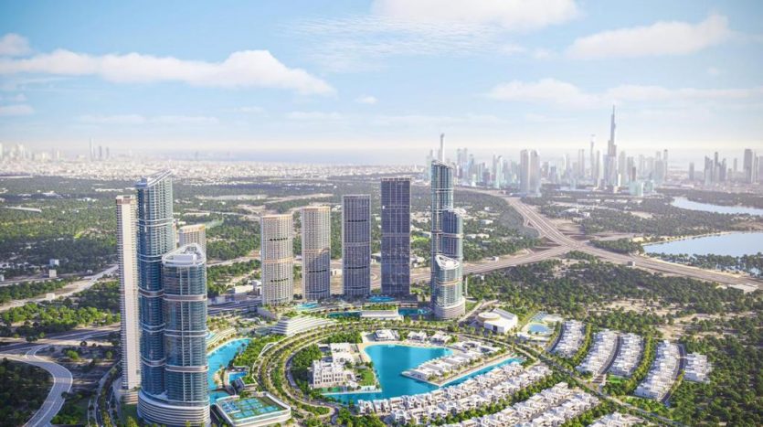 Vue aérienne d&#039;un paysage urbain moderne avec de grands gratte-ciel, un grand lac artificiel, des espaces verts luxuriants et des routes courbes, avec des gratte-ciel lointains sous un ciel clair à Dubaï.