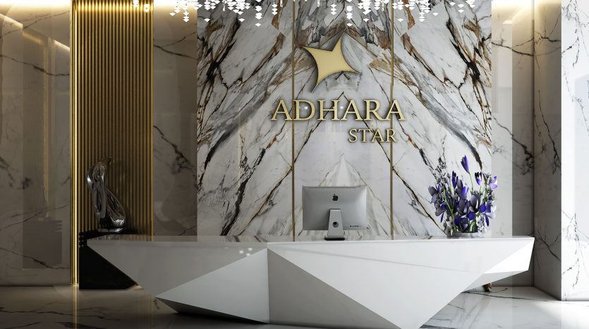 Hall d&#039;entrée luxueux avec une réception géométrique étiquetée &quot;Adhara Star&quot;, des murs en marbre avec des accents dorés, un éclairage au sol élégant, des fleurs et des sculptures décoratives, semblable à un appartement haut de gamme dans