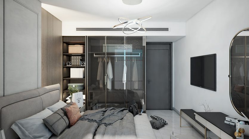 Chambre de villa moderne à Dubaï comprenant un grand lit avec une literie grise, des portes d&#039;armoire en verre transparent, des meubles élégants, un plafonnier unique et une décoration minimaliste dans une palette de couleurs monochromes.