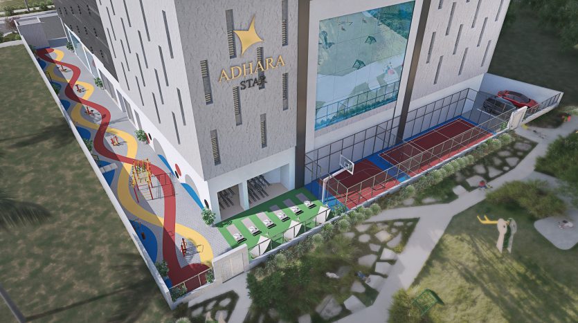 Vue aérienne d&#039;un complexe sportif moderne avec un mur d&#039;escalade coloré, des terrains de basket-ball et des courts de tennis, situé entre de grands bâtiments à Dubaï.
