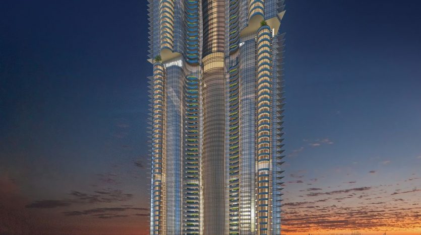 Un gratte-ciel imposant et futuriste avec de multiples sections incurvées et éclairées s&#039;élève sur un ciel crépusculaire, surplombant Dubaï, animé de lumières et de routes.