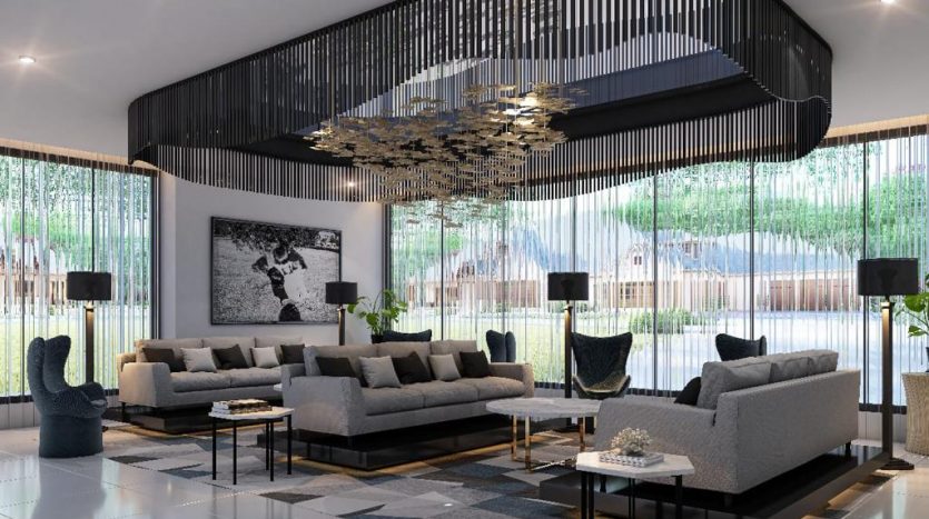 Salon moderne dans un appartement de Dubaï avec de grands canapés gris, des tables basses géométriques et un lustre tendance. Les baies vitrées offrent une vue sur la verdure extérieure.
