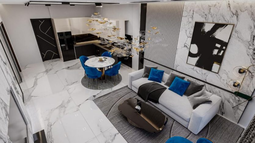Luxueux appartement moderne à Dubaï avec sol en marbre, comprenant un coin repas avec des tables élégantes, un espace de vie confortable avec des canapés moelleux et une kitchenette élégante. Les accents noirs et bleus enrichissent le blanc