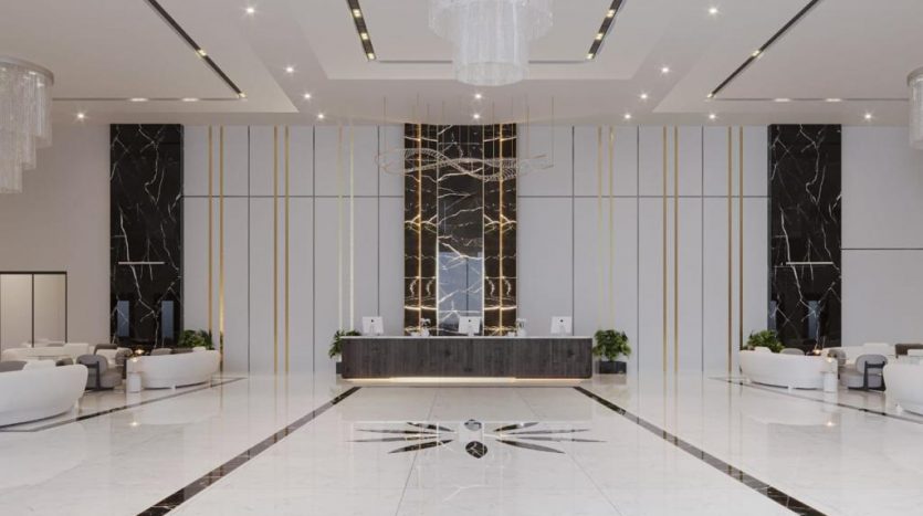 Lobby d'hôtel moderne avec sols en marbre, canapés blancs, réception sombre et lustre central saisissant. Des accents dorés et d'élégants panneaux de marbre noir rehaussent l'ambiance luxueuse de cet hôtel de style villa à Dubaï