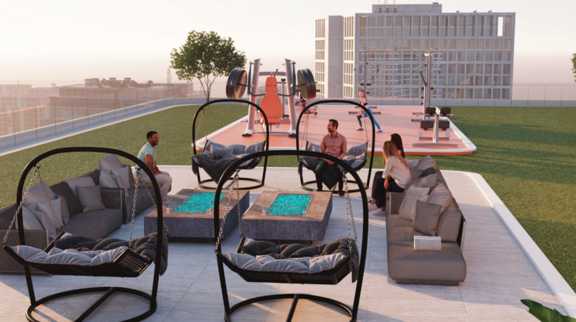 Espace de rassemblement sur le toit doté d&#039;un mobilier d&#039;extérieur moderne dans un contexte urbain au coucher du soleil, avec des gens socialisant et utilisant des équipements d&#039;exercice dans un emplacement privilégié d&#039;une villa à Dubaï.