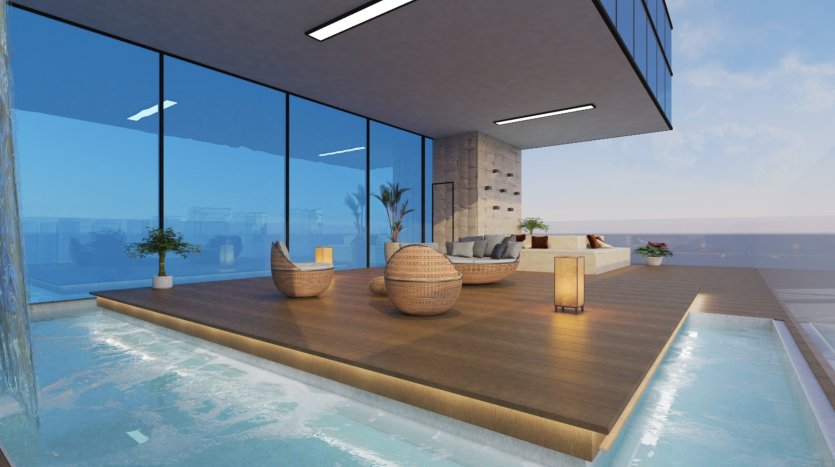 Espace piscine intérieure moderne avec un bord à débordement, des murs de verre donnant sur l&#039;océan, des chaises en osier élégantes, un canapé et des plafonniers intégrés, créant un espace de détente serein dans une villa de Dubaï.