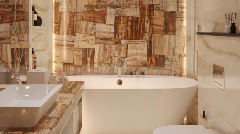 Une salle de bains moderne dans une luxueuse villa à Dubaï, dotée d&#039;une grande baignoire autoportante, d&#039;un lavabo rectangulaire et de murs aux motifs de marbre uniques aux teintes chaudes, éclairés par un éclairage tamisé.