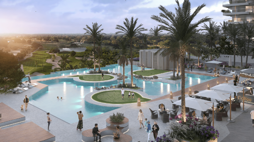 Une scène de villégiature luxueuse comprenant une grande piscine interconnectée entourée de palmiers, de bains de soleil et de cabanes, avec des immeubles de grande hauteur modernes à Dubaï en arrière-plan au crépuscule.