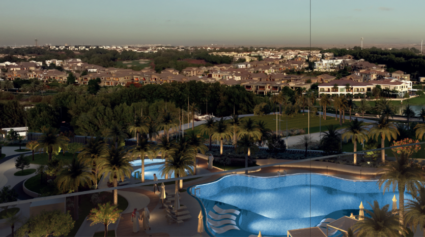 Vue aérienne d&#039;un quartier résidentiel luxueux au crépuscule, doté d&#039;une grande piscine et de jardins bien entretenus, avec un vaste paysage urbain en arrière-plan. Idéal pour ceux qui cherchent à investir à Dubaï